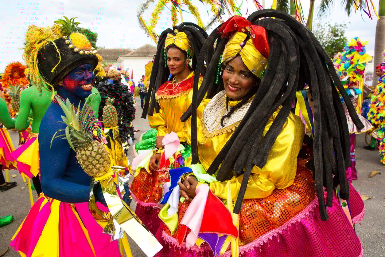 Women in colorful costume during carnival in the Dominican Republic.